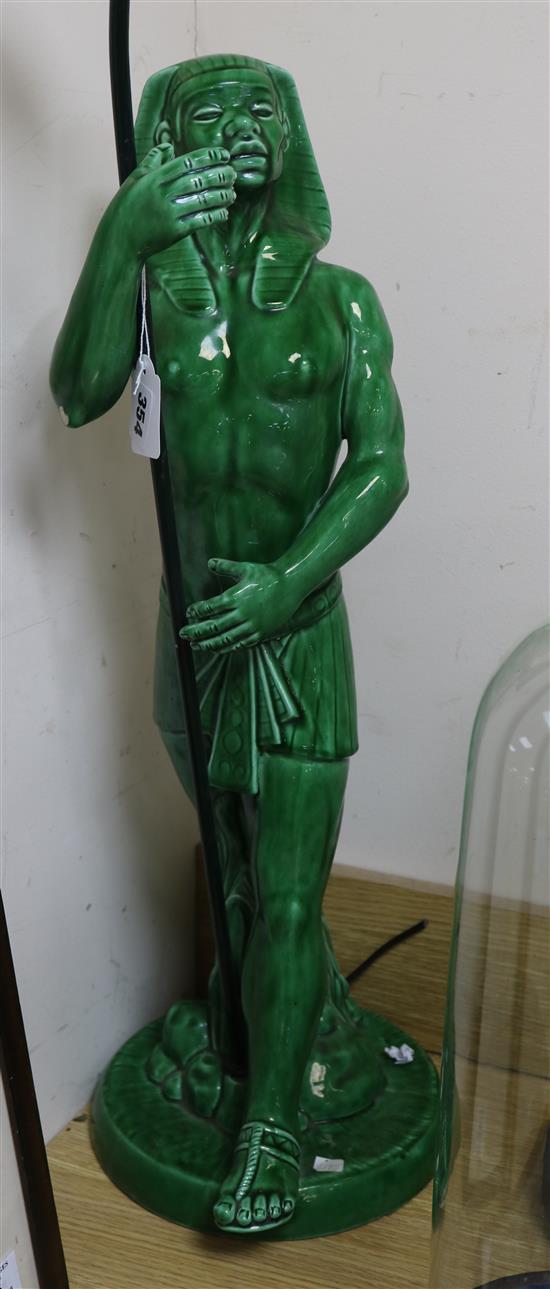 An Egyptian figure pottery table lamp